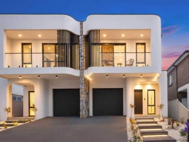 Brand new sophisticated five bedroom duplex showcasing distinctive architectural details