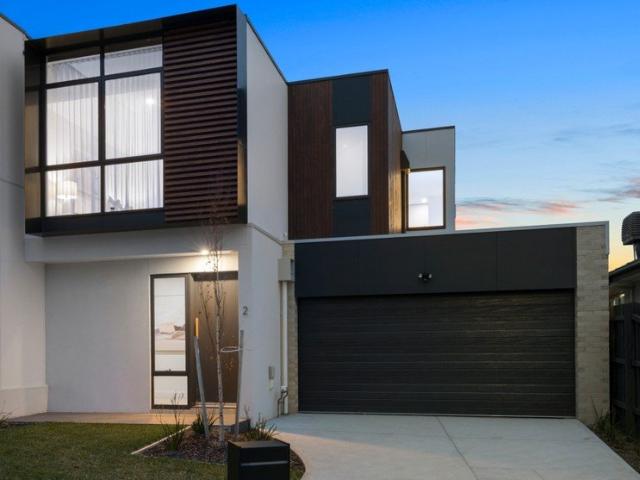 Brand New Streetfront Luxury in a Prestigious Golf Course Locale