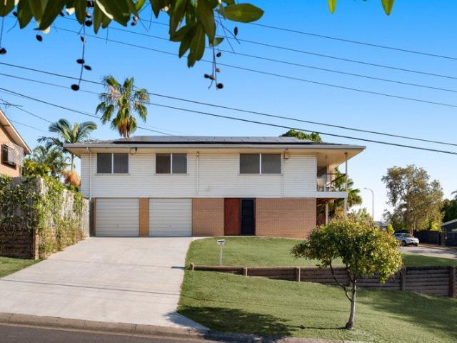 Breezy corner block retreat with leafy outlooks + exceptional lifestyle convenience