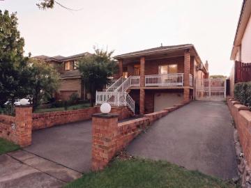 Brick Four Bedroom Family Home on 803sqm with Pool and Side Driveway Access