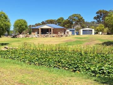 Brick Home with 2 Acres, Creek and so Close to Town Centre