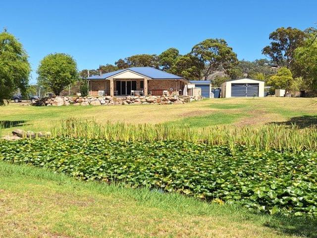 Brick Home with 2 Acres, Creek and so Close to Town Centre