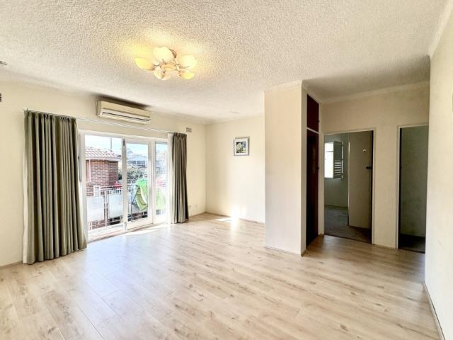 Bright & Convenient Unit in Prime Eastwood Location With one Lock Up Garage + storage shelves