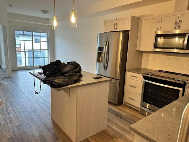 Bright Corner Condo with Pond View |Parking Included| Semi furnished/Unfurnished — 1 Bedroom Condo Unit