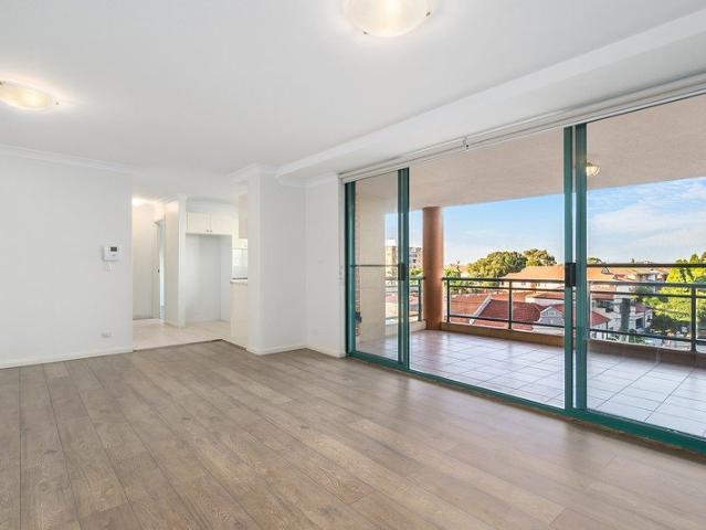 Bright open apartment footsteps from the beach