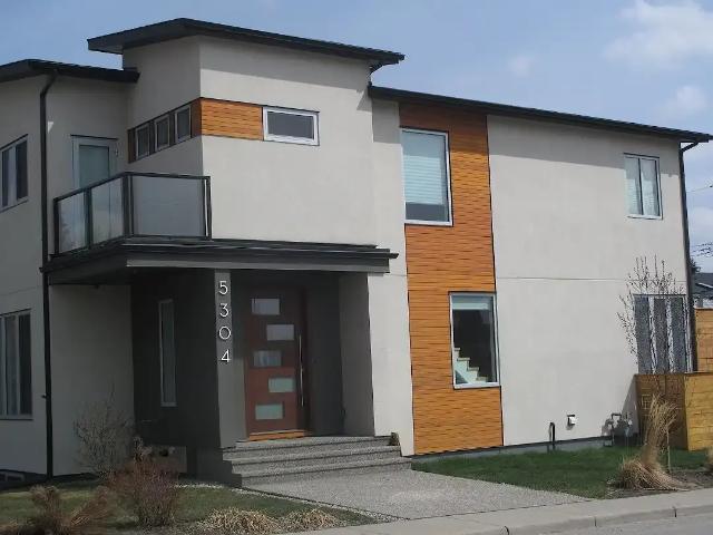 Bright Modern Duplex in North Glenmore — 4 Bedrooms+ Den Duplex