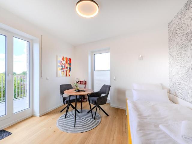 Bright Studio Apartment with Balcony