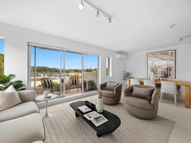 Brilliant bay and city views, tidy apartment with scope to improve