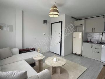 Buca Çamlıkule'de Merkezi Konumda Sıfır Eşyalı 1+1 Kiralık Daire