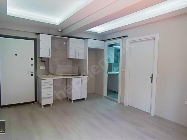 BUCA ŞİRİNYER DE YENİ SIFIR BİNADA YERDEN ISITMALI KİRALIK 1+1