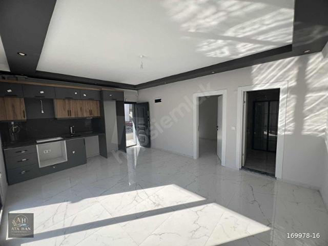BURHANİYE ÖĞRETMENLERDE BAHÇELİ 1+1 SATILIK DAİRE