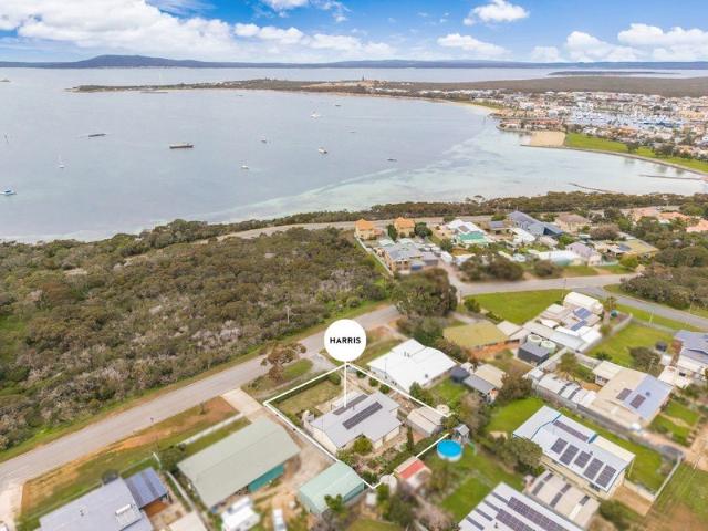 Captivating coastal living with exceptional potential.