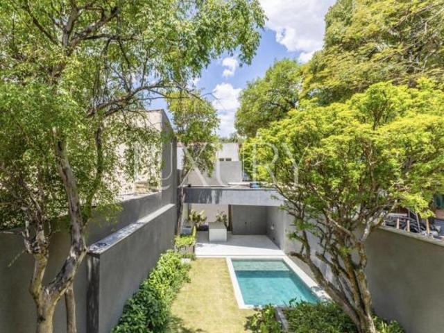 Casa nova e contemporânea com arquitetura autoral no Jardim Europa — 4 suítes, piscina e integração