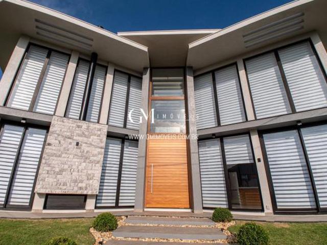 Casa nova no condomínio Ocean Side com 5 suítes Torres RS