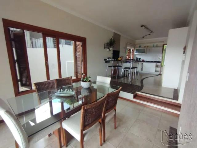 Casa residencial à venda no bairro Ouro Branco com 237 m² e 3 dormitórios/quartos