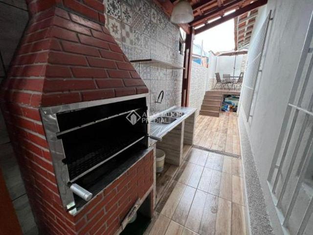 CASA A VENDA 2 DORM,2 VAGAS, COM PISCINA NA PRAIA GRANDE NO BAIRRO MARACANÃ!