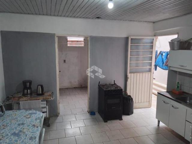 Casa a venda com dois quartos e um dormitório