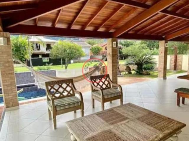 CASA À VENDA EM CONDOMÍNIO DE ALTO PADRÃO EM GUAECA, 50M DA PRAIA 6 SUÍTES, 2 LAVABOS, 2 SALAS, JARD