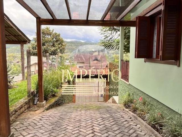 Casa à venda em Três Coroas RS, bairro Mundo Novo III, 3 quartos, 1 sala, 3 banheiros, 1 vaga, 75m²
