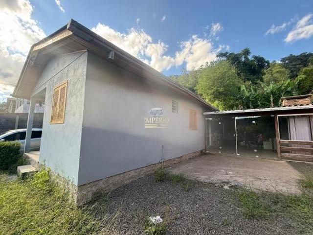 Casa à venda em Três Coroas RS, bairro Loteamento do Raul: 2 quartos, sala, banheiro, 1 vaga, 90m²