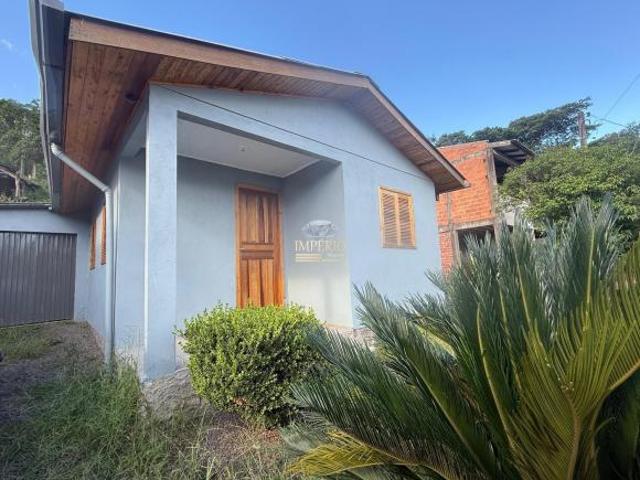 Casa à venda em Três Coroas RS, bairro Loteamento do Raul: 2 quartos, sala, banheiro, 1 vaga, 90m²