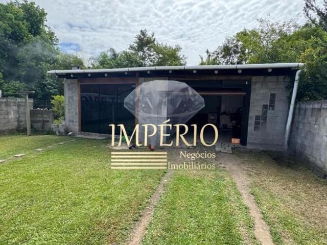 Casa à venda em Três Coroas RS, bairro Sander: 2 quartos, 1 sala, 2 banheiros, 1 vaga de garagem, 90