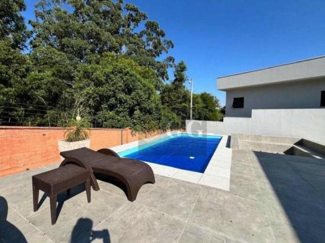 Casa com 4 dormitórios à venda, 350 m² por R$ 3.099.000 Alphaville Porto Alegre/RS
