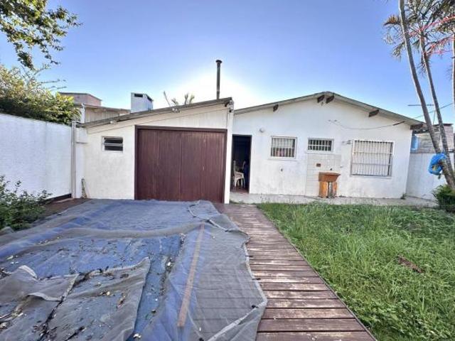 Casa com 4 dormitórios em Atlântida Sul