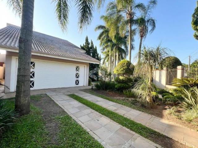 Casa com 500m², 4 dormitórios, sendo 1 suíte, espaço gourmet com churrasqueira, sala de jogos, pisci