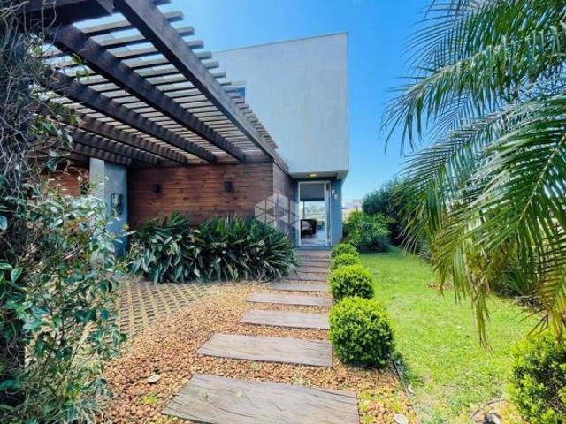 Casa com 03 súites, mobiliado no condomínio One Atlântida House na praia de Atlântida em Xangri Lá