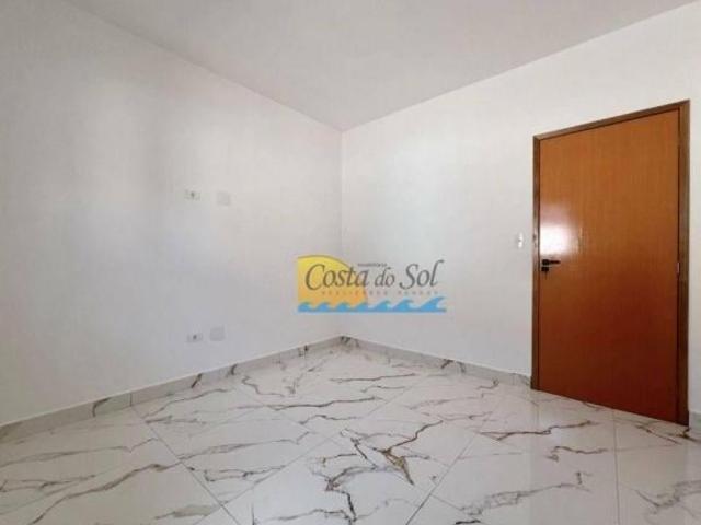 Casa com 3 dormitórios à venda, 119 m² por R$ 600.000,00 Tude Bastos Praia Grande/SP