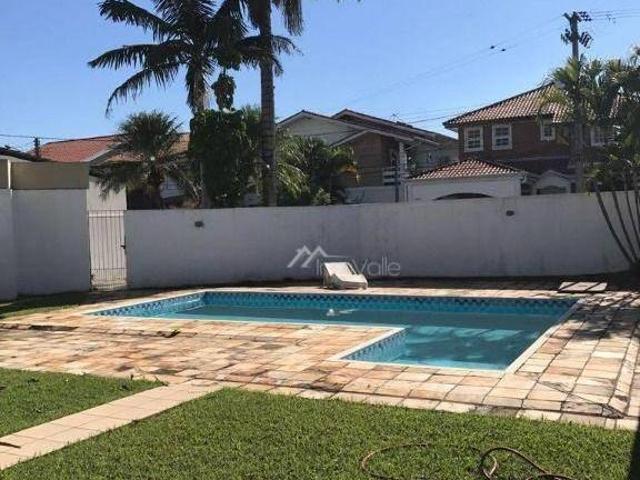 Casa com planta e dois terrenos