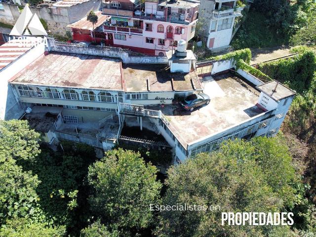 CASA CON EDIFICIO Y TERRENO DE 1.19 HECT?REAS EN HUAUCHINANGO