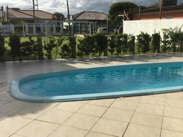 Casa em Atlântida em dois terrenos