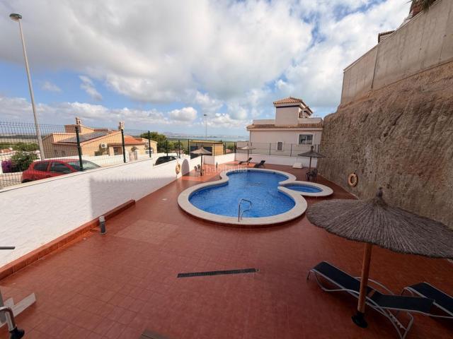 Casa en venta en Cartagena, Los Urrutias. Dúplex con vistas al Mar Menor, piscina comunitaria y solárium en El Carmolí. Casas.