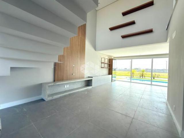 Casa sobrado 4 suítes semi mobiliada piscina 165m² Condomínio Joy Xangri Lá/RS