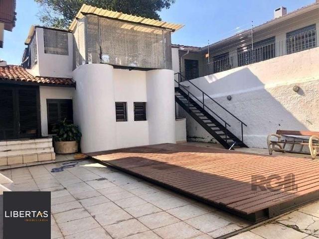 Casa / Sobrado para Venda em Porto Alegre/RS Três Figueiras 4 Quartos