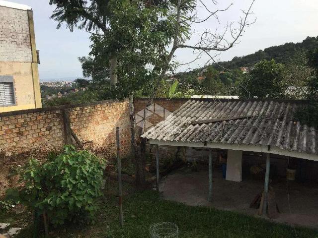 Casa / Sobrado para Venda em Porto Alegre/RS Vila Nova 3 Quartos