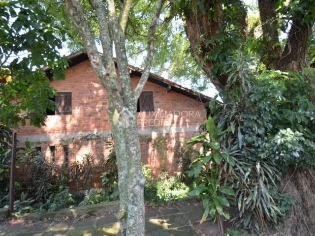 Casa / Sobrado para Venda em Porto Alegre/RS Vila Nova 4 Quartos