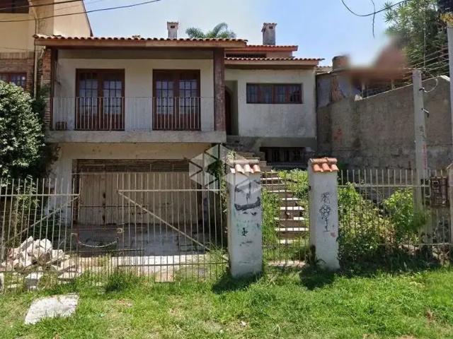 Casa / Sobrado para Venda em Porto Alegre/RS Passo da Areia 3 Quartos