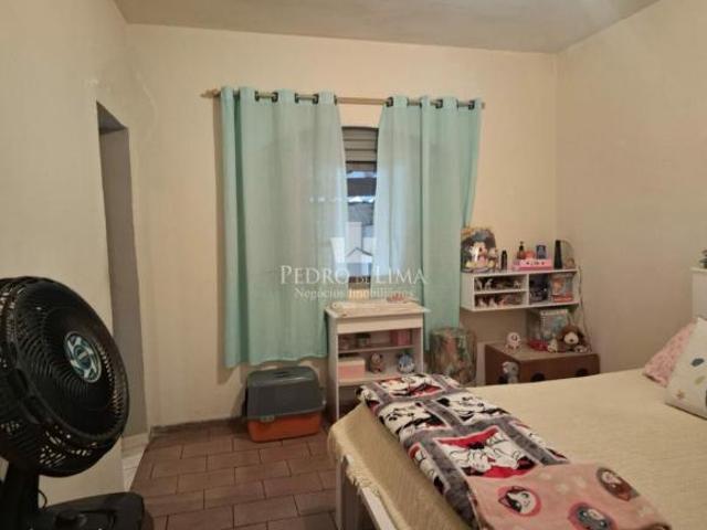 Casa térrea, com dois quartos, sala, cozinha, escritório, 2 banheiros, 2 vagas cobertas no Cangaiba