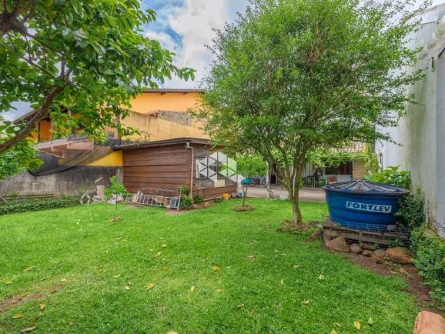 Casa à venda no Bairro Bela Vista em Canoas 4 dormitórios, suíte máster, área gourmet, pátio amplo