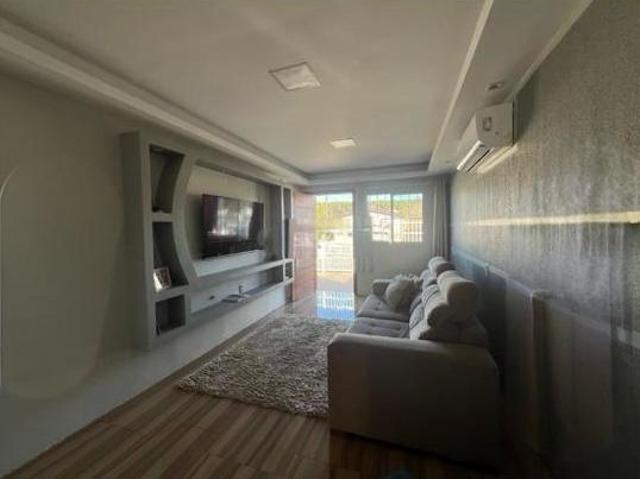 Casa 2 dormitórios no bairro Santa Rita/ Guaiba, com terreno de 10X30