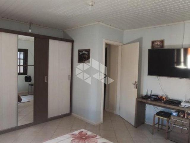 Casa 4 dormitórios sendo uma suíte e 4 vagas bairro Monhos de Vento, Canoas/RS