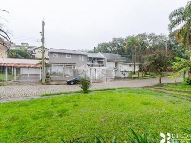 Casa 4 dorms à venda Rua Edgar Luiz Schneider, Jardim Isabel Porto Alegre
