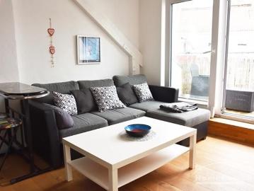 Center, Modernly furnished attic apartment with roof terrace and open kitchen in a central but quiet location