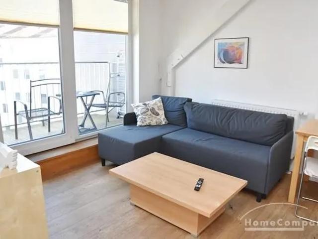 Center, Modernly furnished attic apartment with roof terrace and open kitchen in a central but quiet location