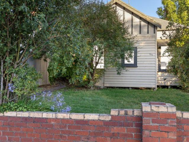 Central Convenience with Rear Lane Access