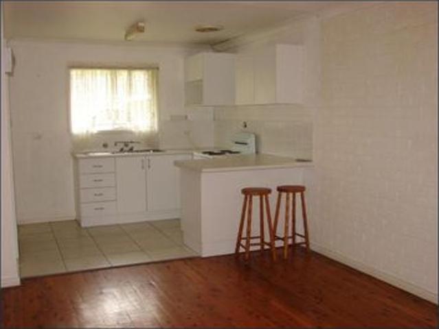 CENTRAL LOCATION THIS TIDY RESIDENTIAL FLAT WITH ITS OWN CARPORT