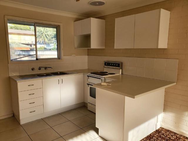 CENTRAL LOCATION THIS TIDY RESIDENTIAL FLAT WITH ITS OWN CARPORT